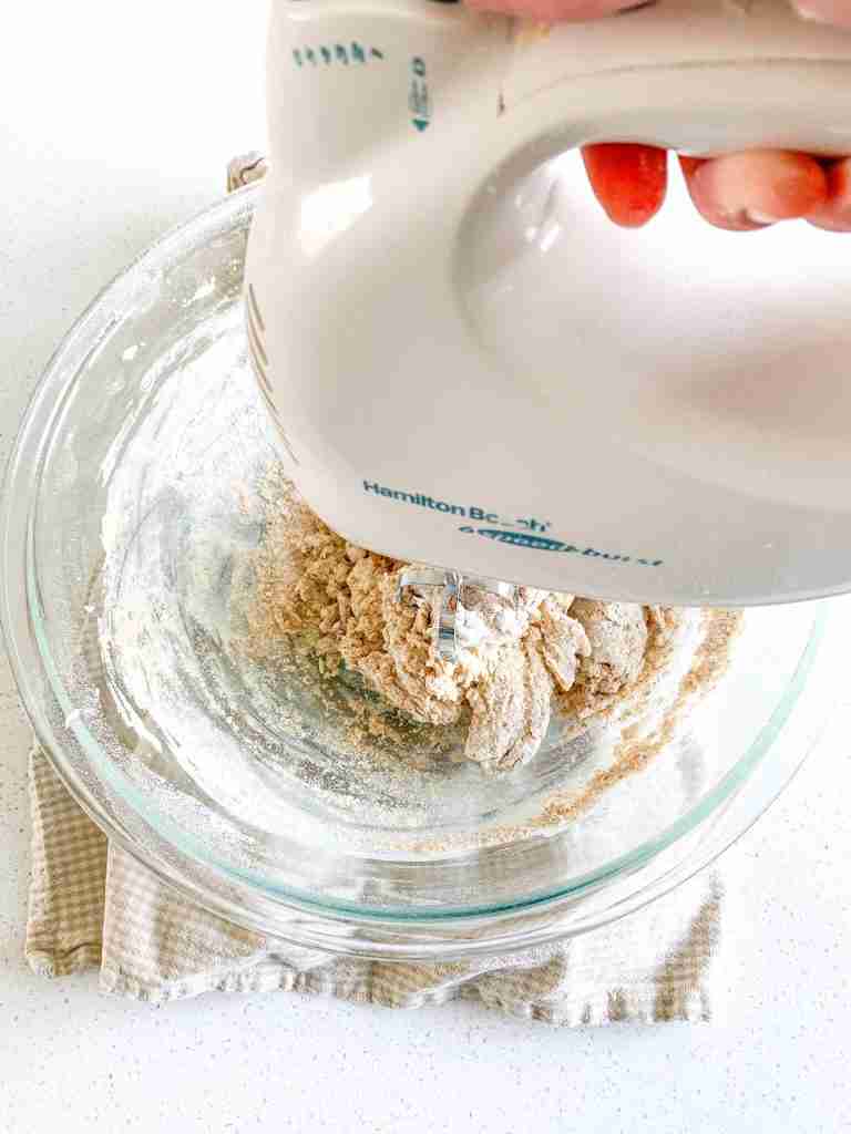 hand mixer combining ingredients