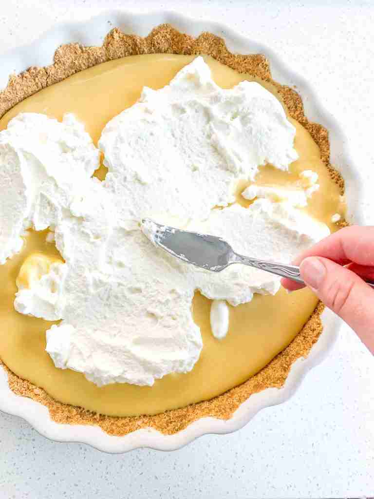 spread whipped cream on top of tart