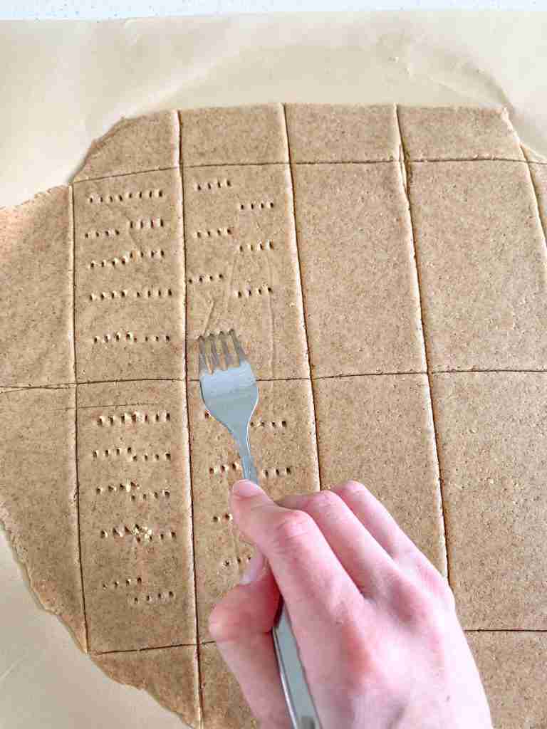 fork making holes in sourdough graham crackers
