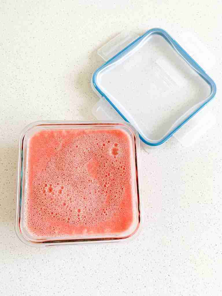 watermelon sorbet in a container ready to freeze