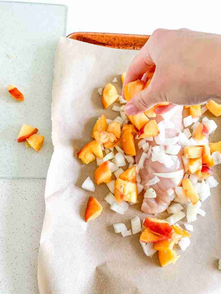 adding peaches to sheet pan