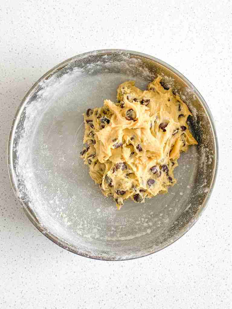 blondie dough in a pan ready for spreading