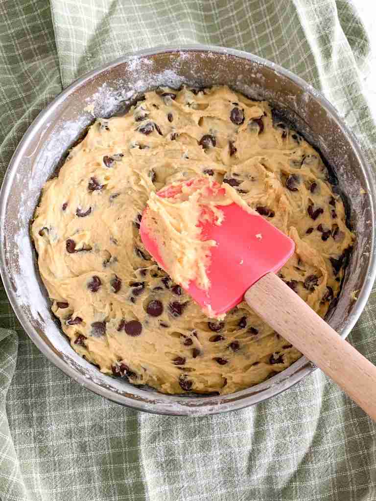 blondie dough spread in a thin layer in a cake pan