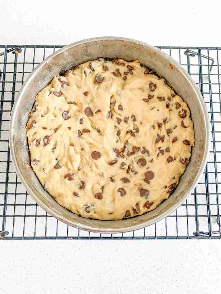 sourdough blondies cooling on a wire rack in the pan