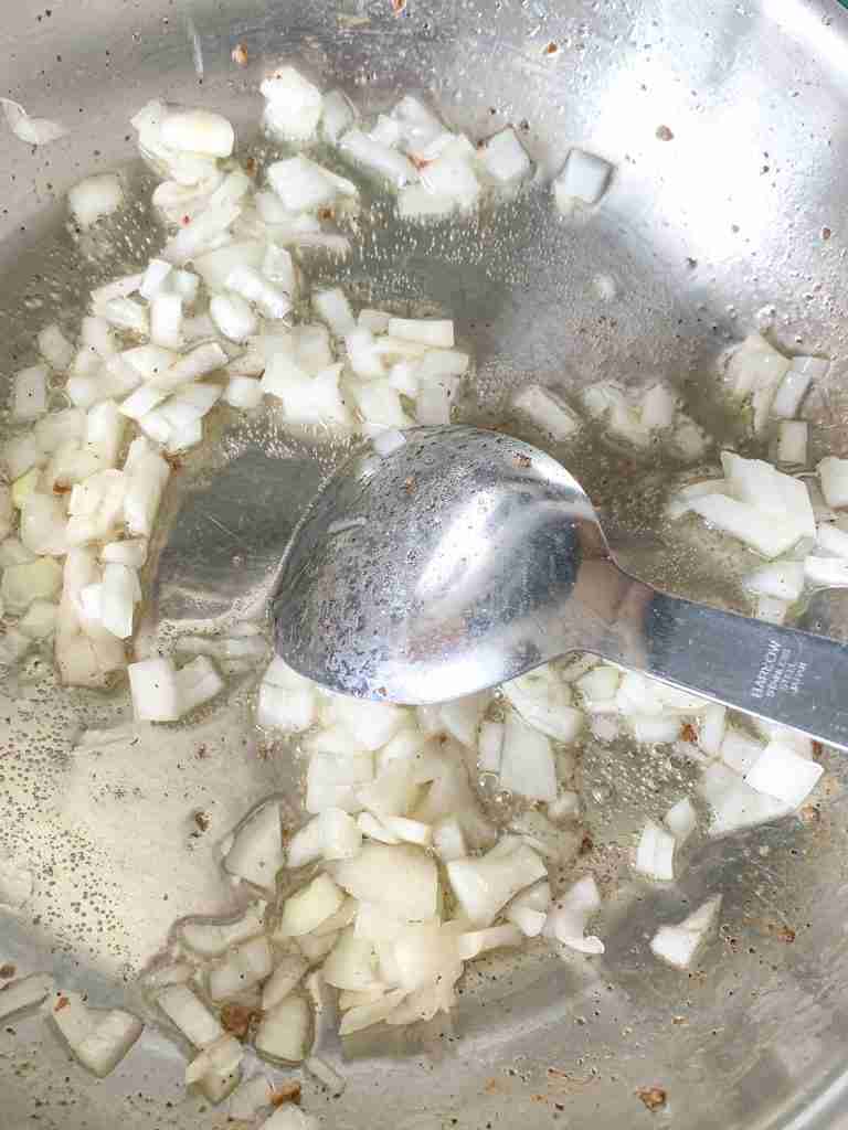 cooking onions in a skillet
