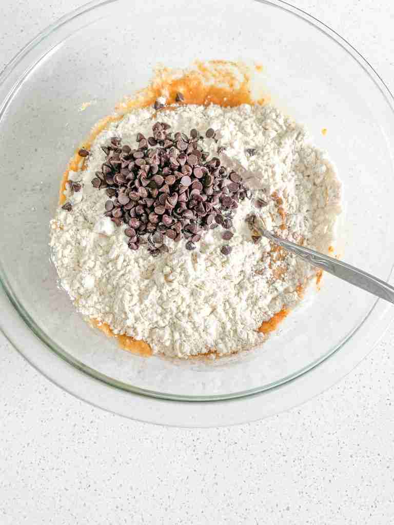 dry ingredients getting mixed into wet with a fork
