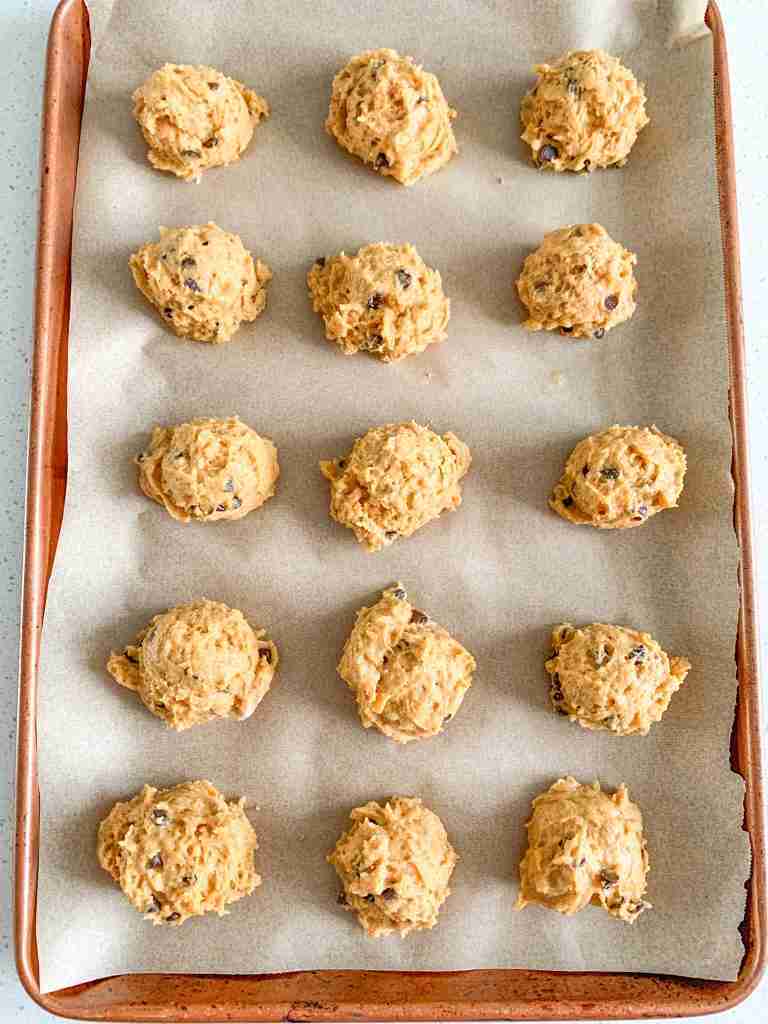sourdough pumpkin cookie dough scooped onto a sheet pan