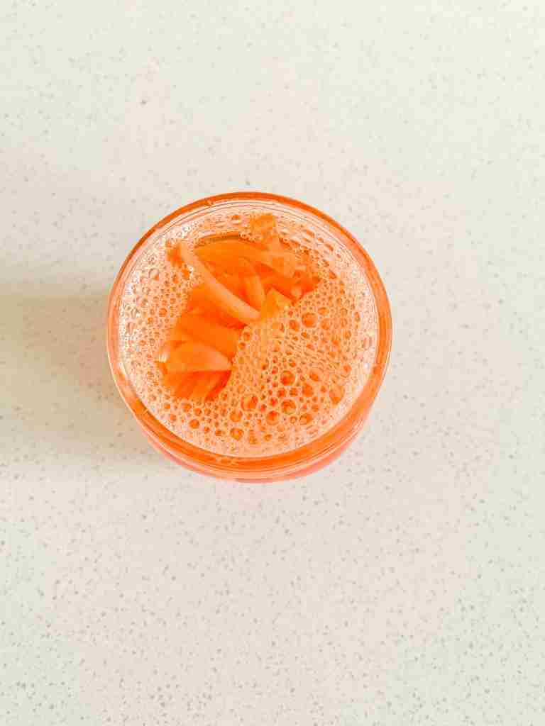 pickling solution in the jar with carrots