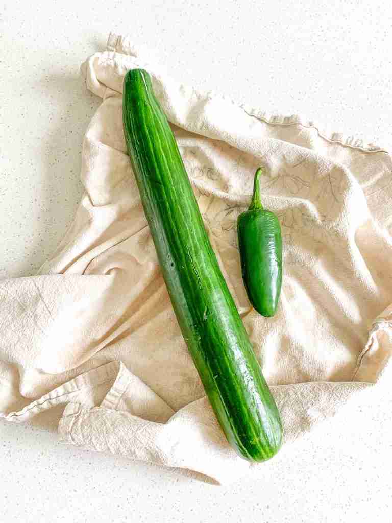cucumber and jalapeno washed and drying on a towel
