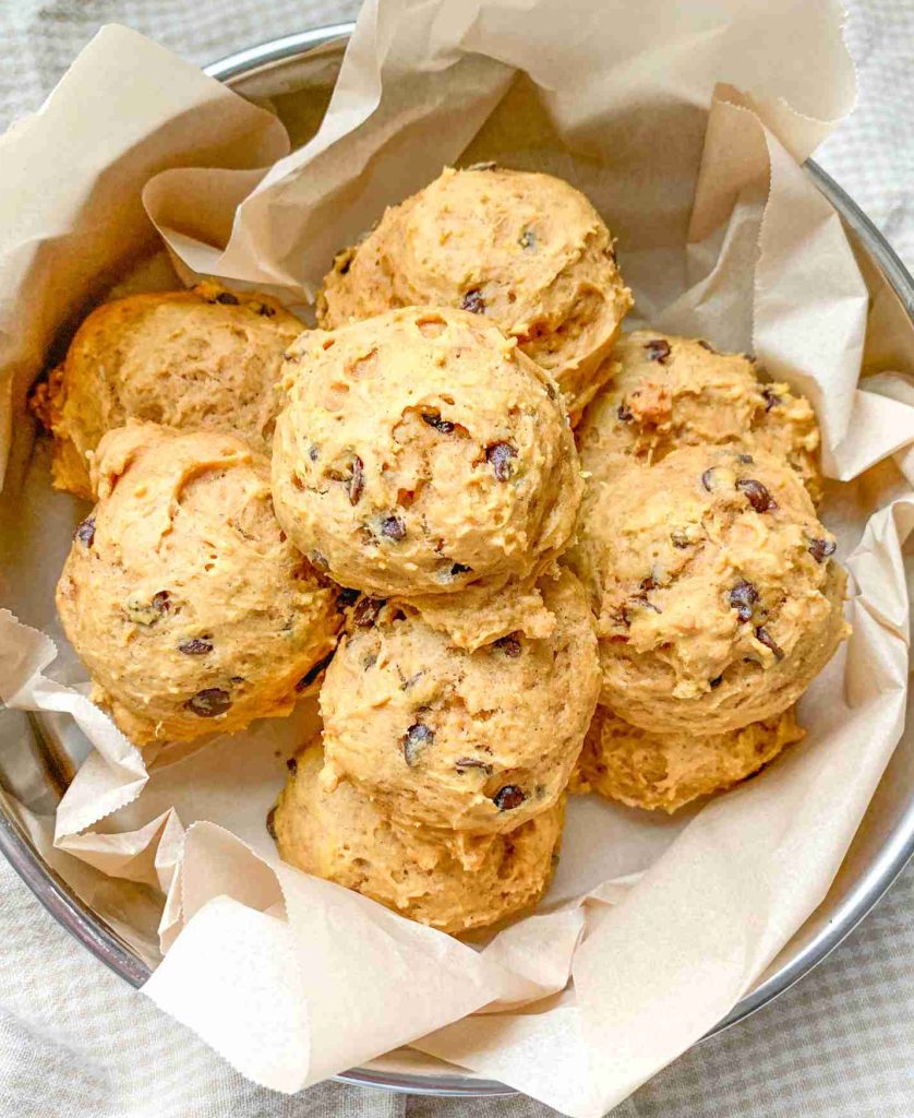 freshly baked mini sourdough chocolate chip pumpkin cookies in a tin