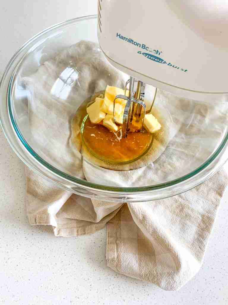 mixing butter and maple syrup in a bowl