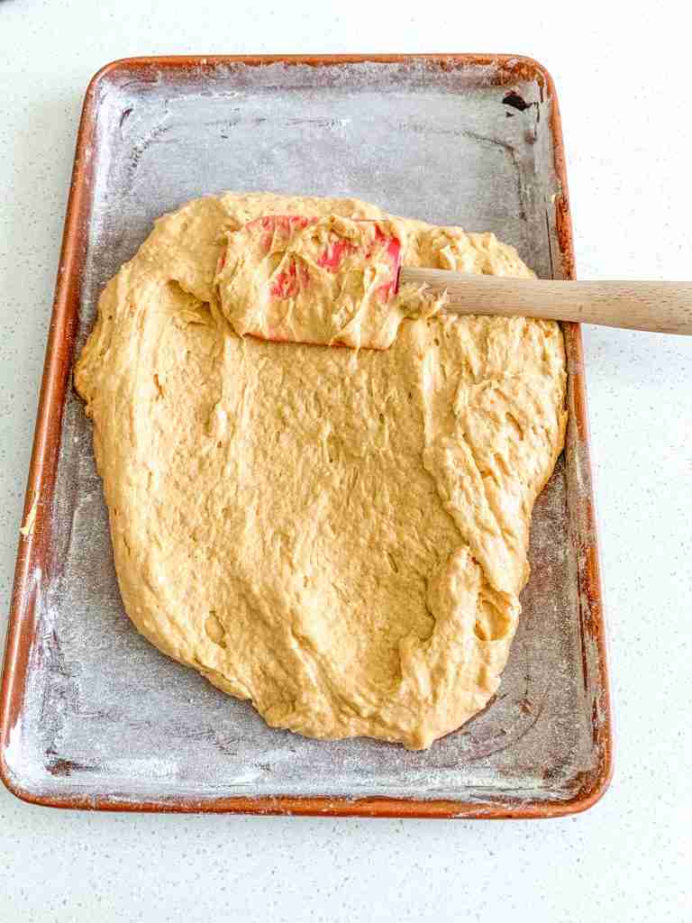 spreading sourdough pumpkin cake batter