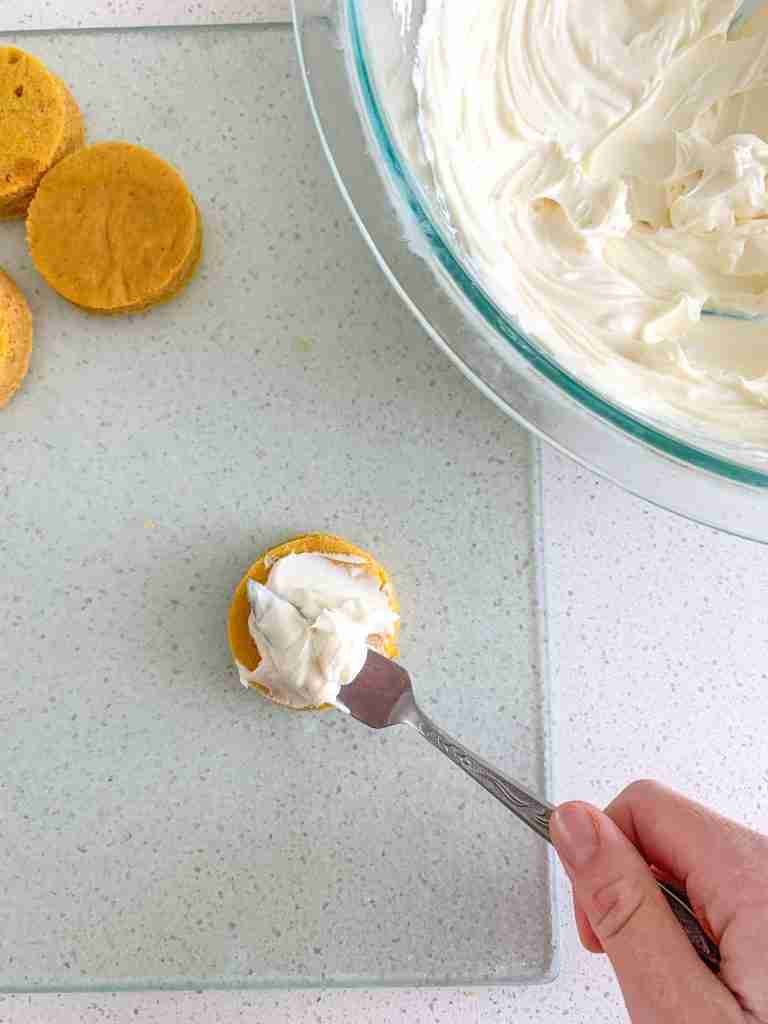 spreading frosting on cake bite