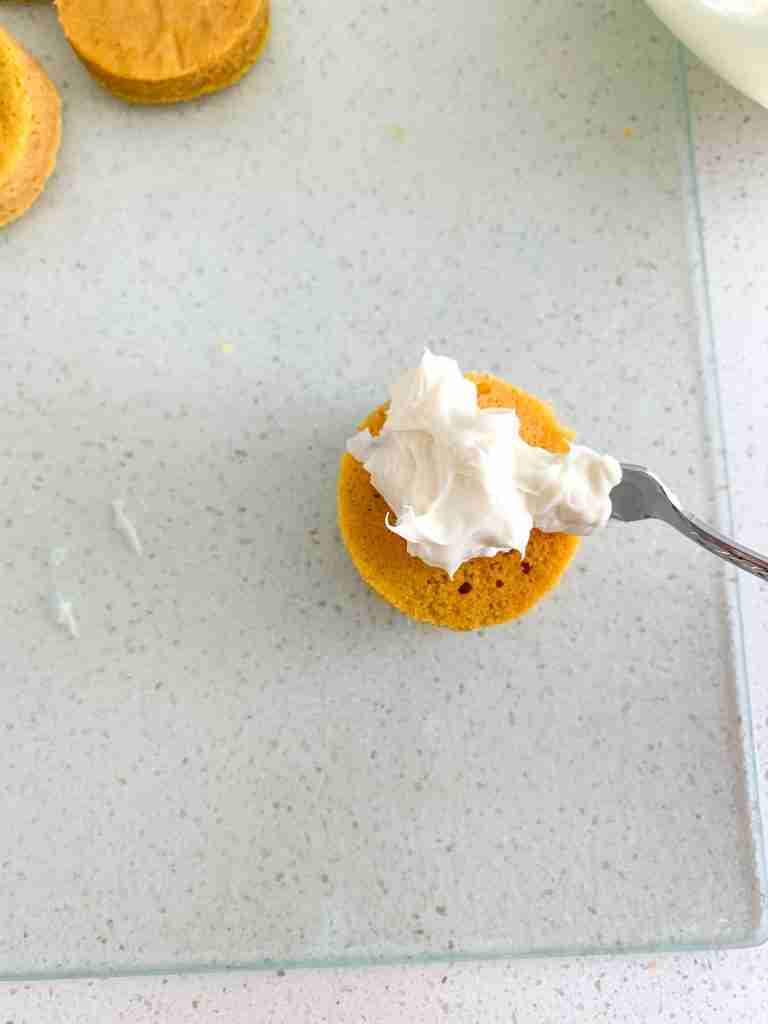 spreading frosting on cake bite