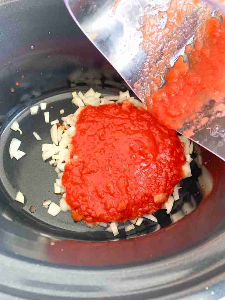 adding blended tomatoes to slow cooker