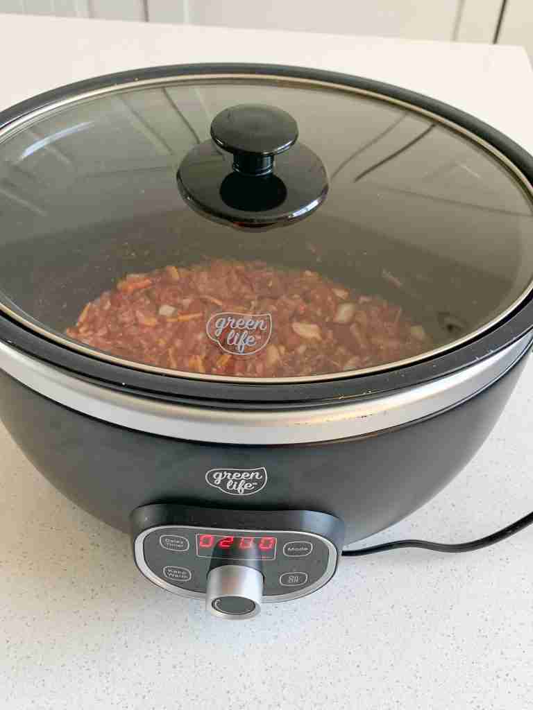 walking taco meat cooking in slow cooker