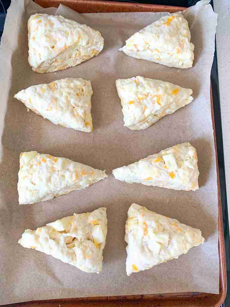 shaped sourdough scones on a sheet pan