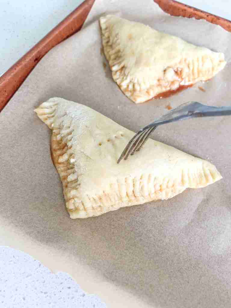 poking holes on top of apple turnovers before baking
