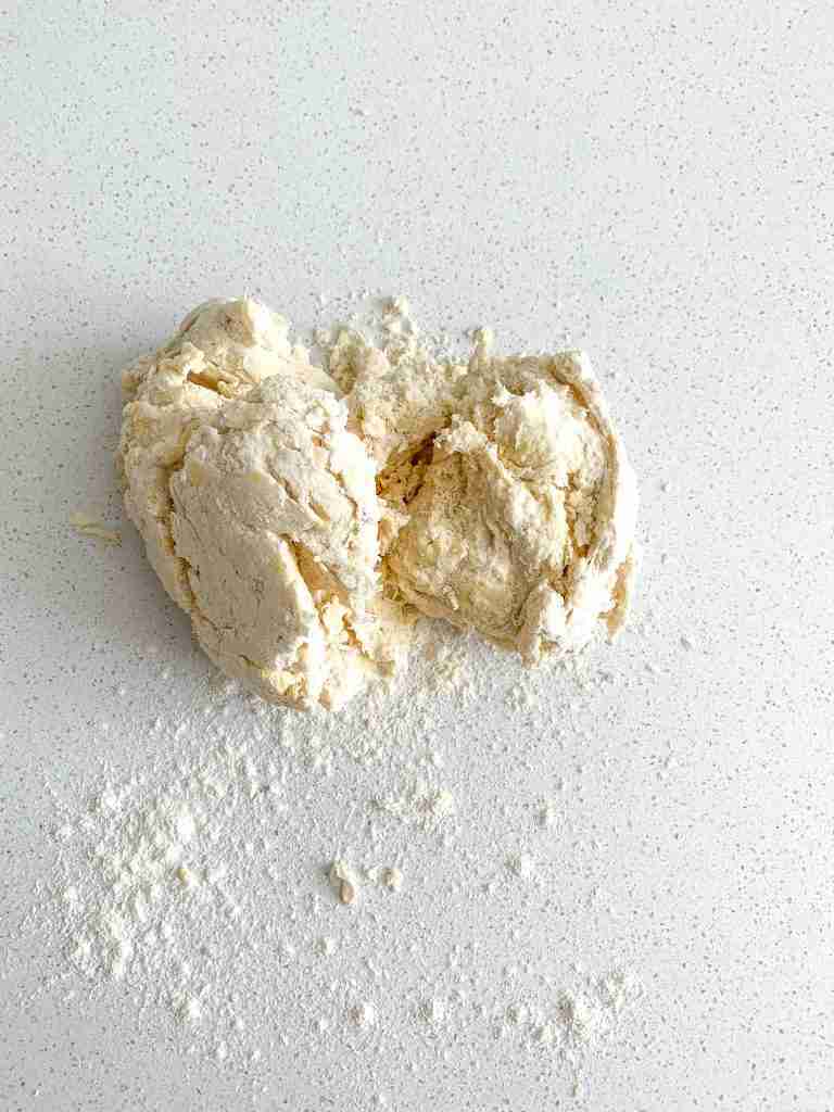 angel biscuit dough turned out on the counter and ready to be kneaded