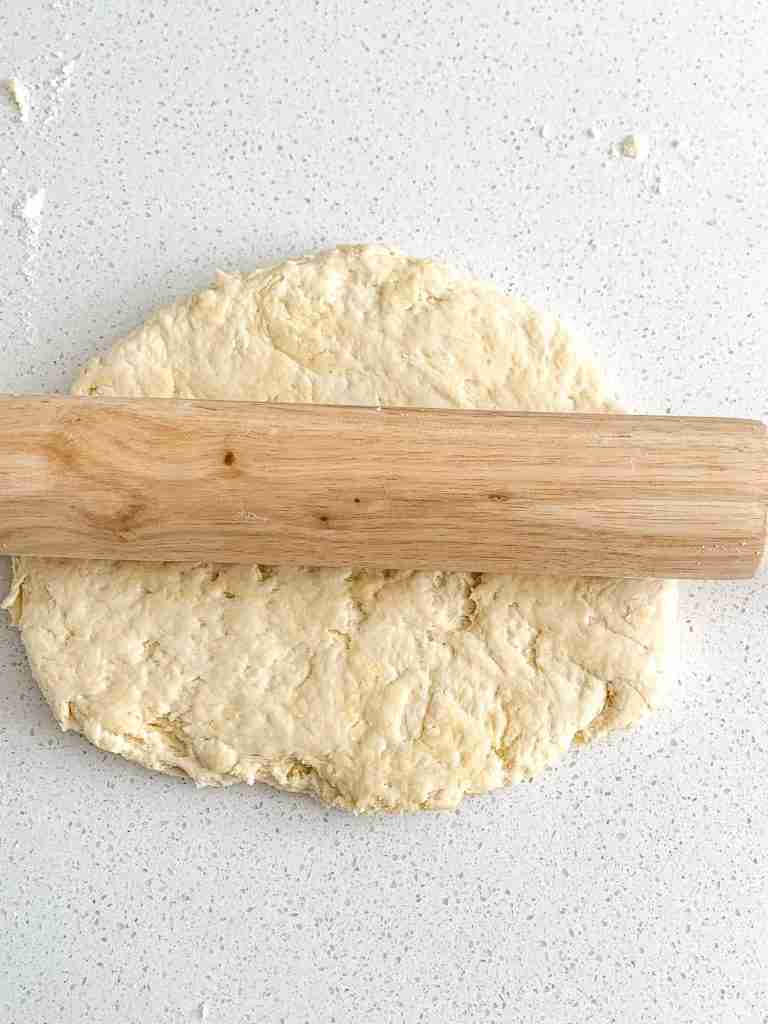 rolling angel biscuit dough out