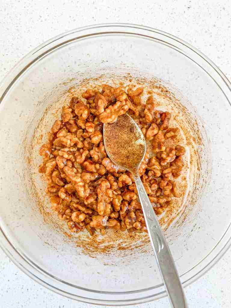 stirring savory walnut mixture to combine