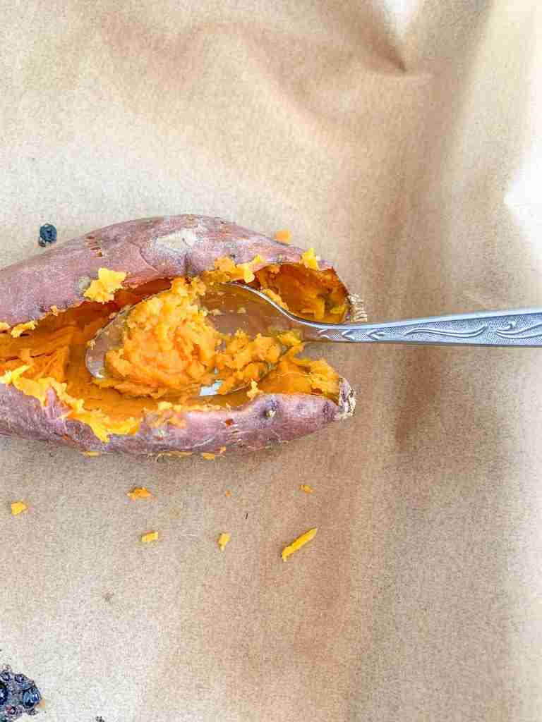 taking baked sweet potato out of skins