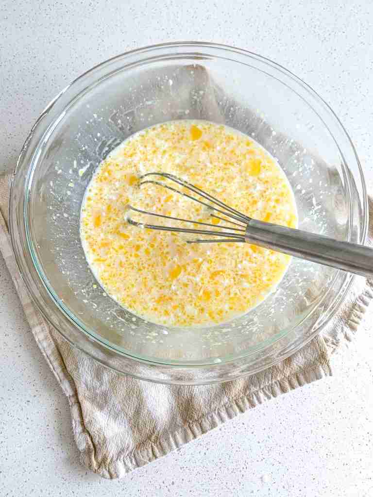 combining wet corn casserole ingredients