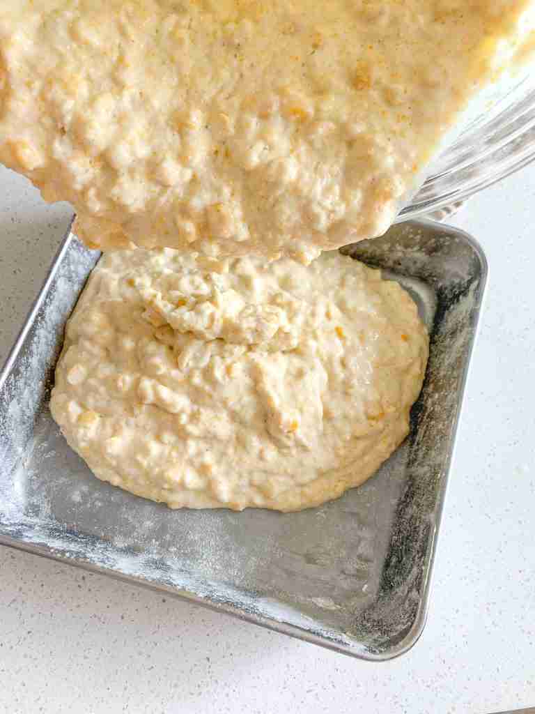 corn casserole batter poured into a pan