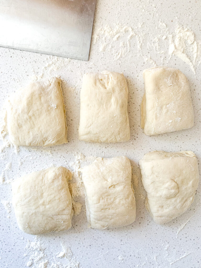 hawaiian roll dough sliced into 6 pieces