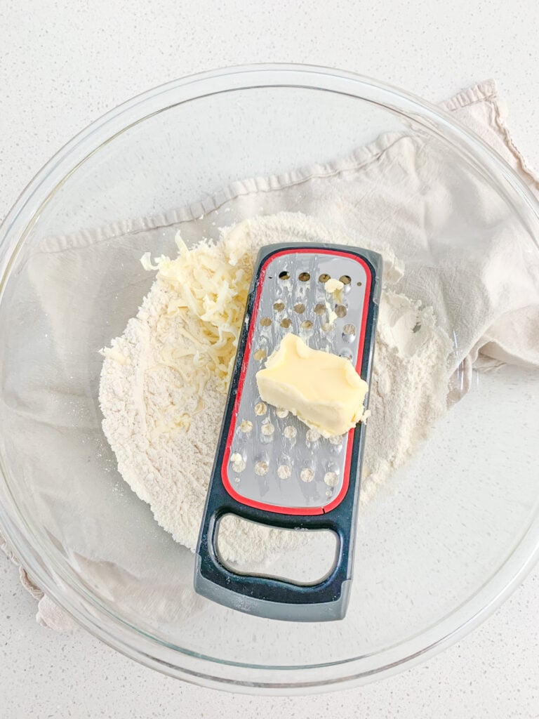 grating butter into dry ingredients for danish dough