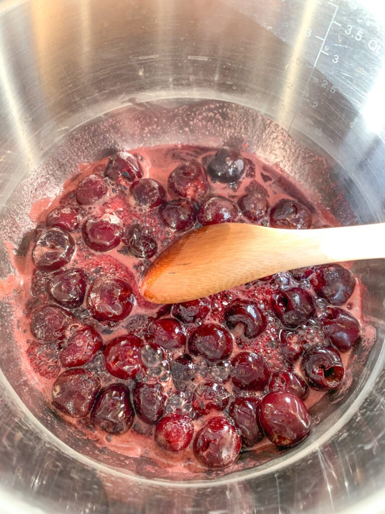 stirring cherry filling ingredients while cooking