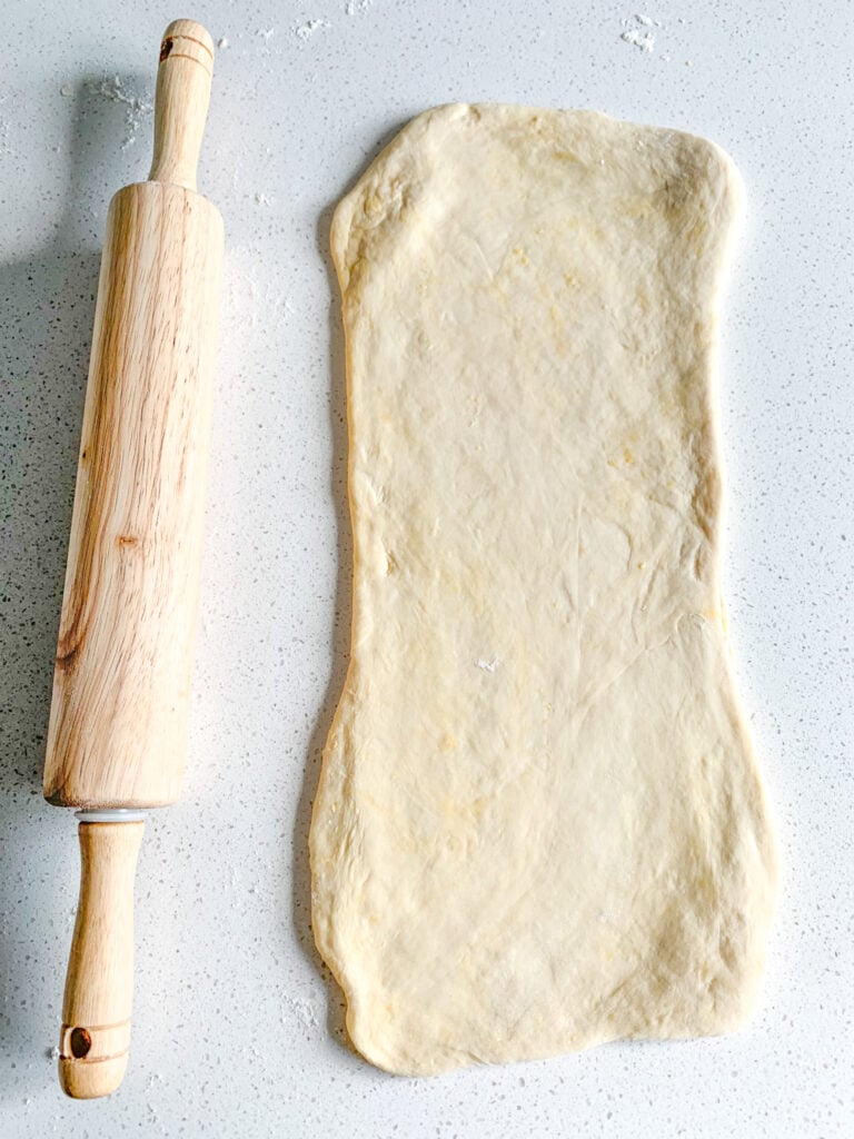 laminated sourdough danish dough getting rolled out