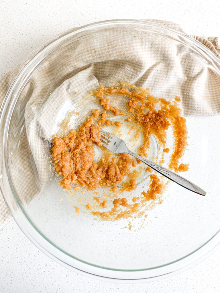 mixing butter and sugar with a fork
