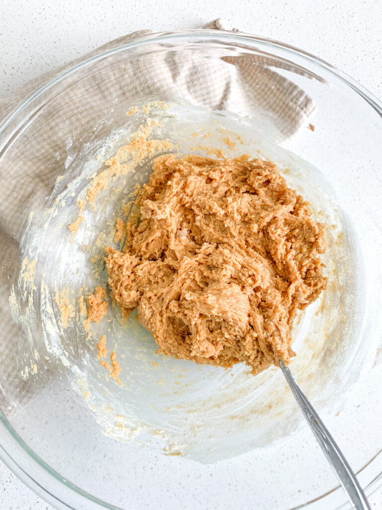 flour mixed into peanut butter cookie mixture