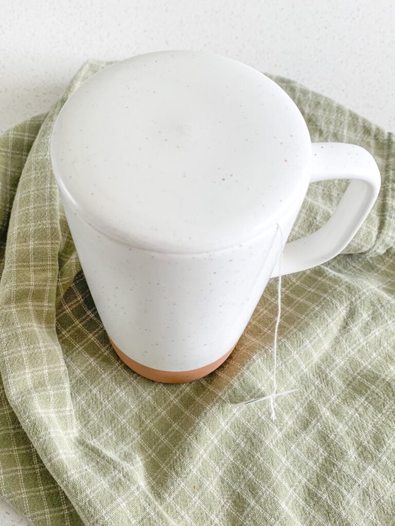 peppermint tea bag steeping in hot chocolate