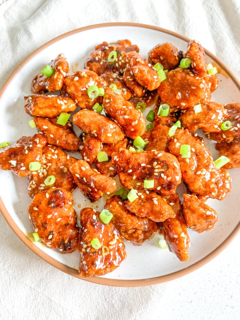 freshly cooked and tossed baked general tso's chicken