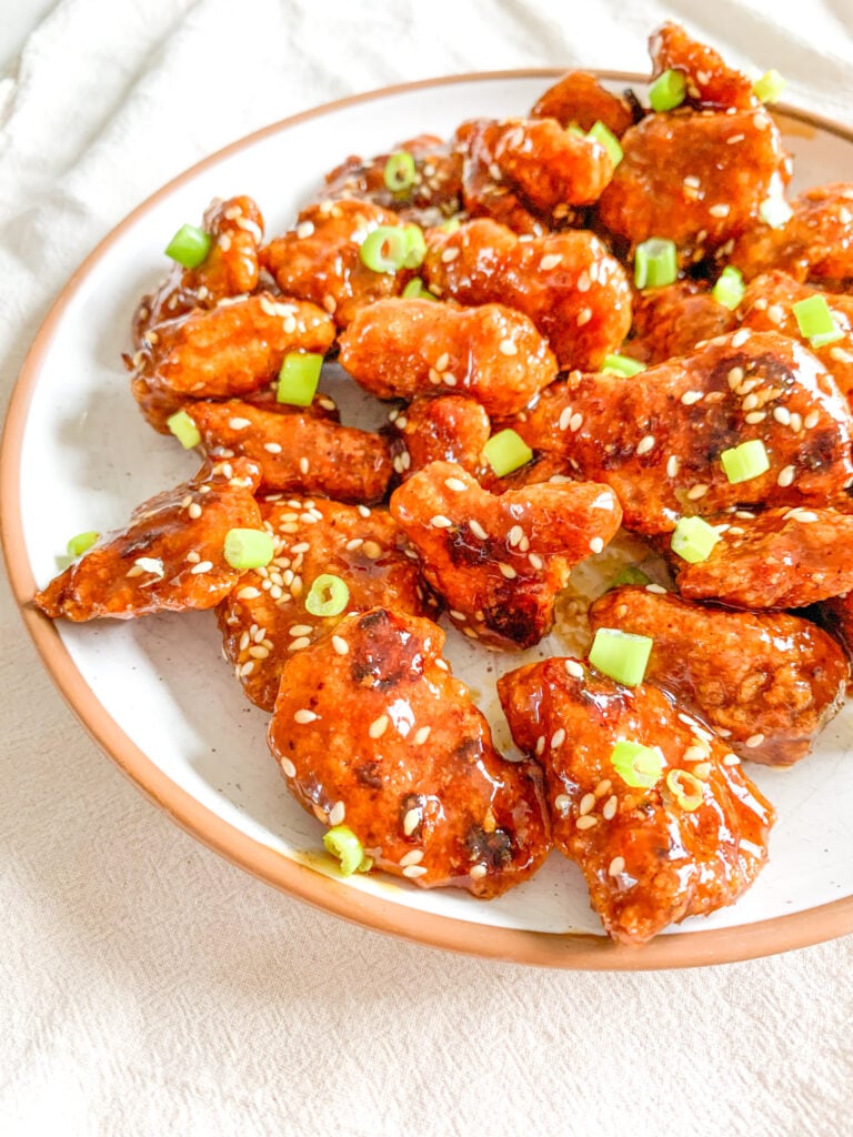 freshly cooked and tossed baked general tso's chicken