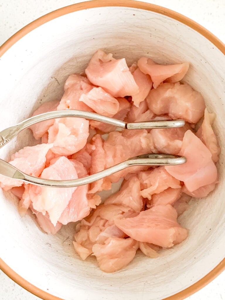 chicken breast cut up and ready for dredging