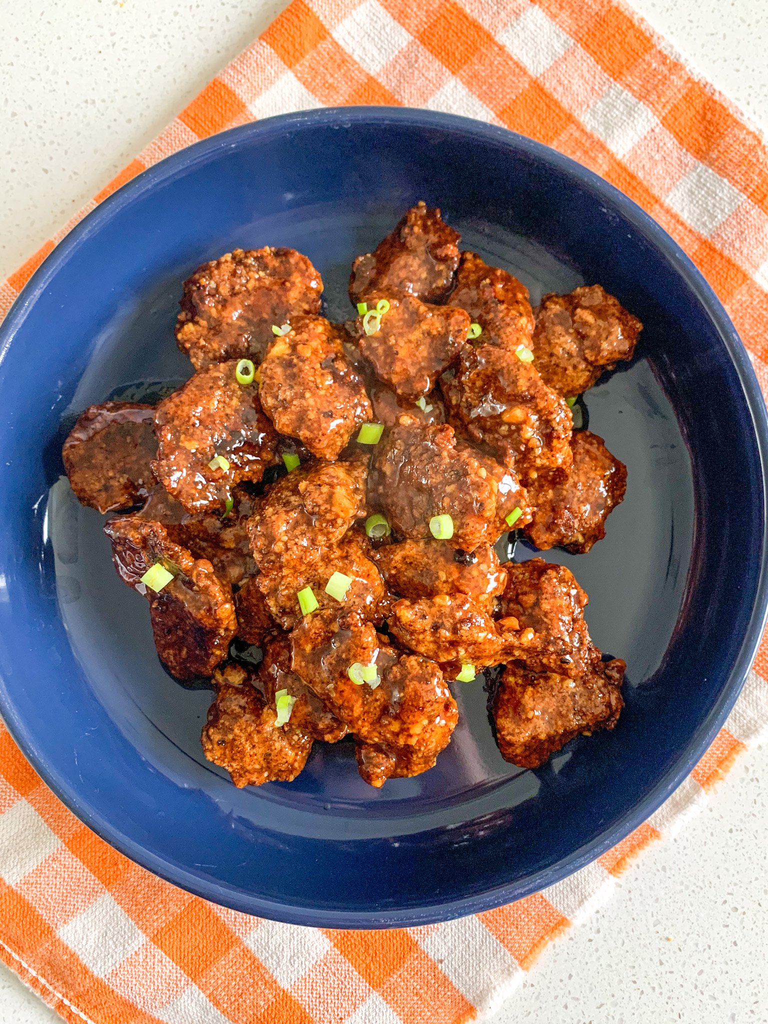 freshly cooked and coated baked orange chicken