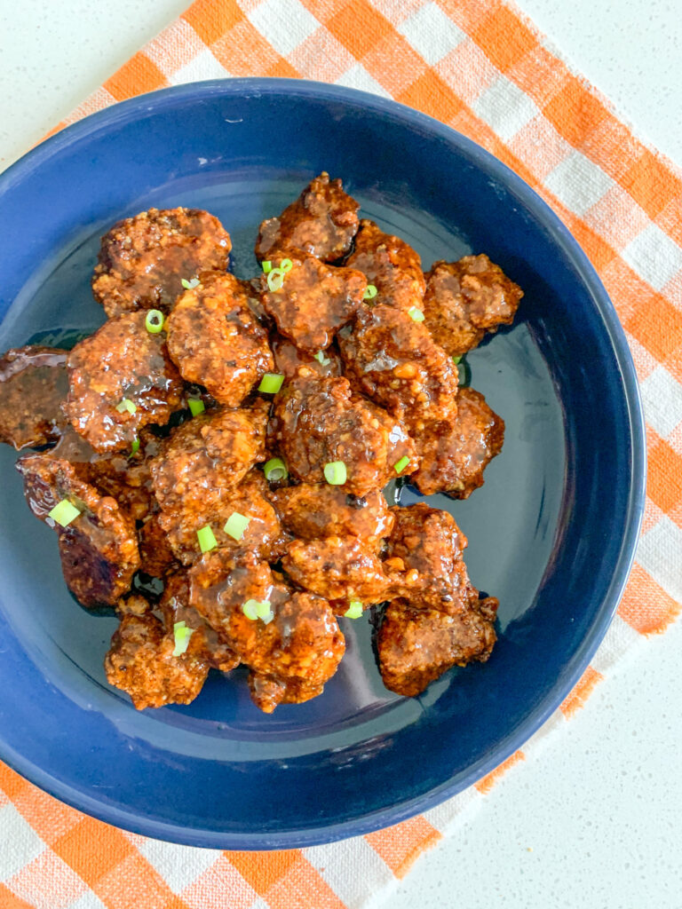 freshly cooked and coated baked orange chicken