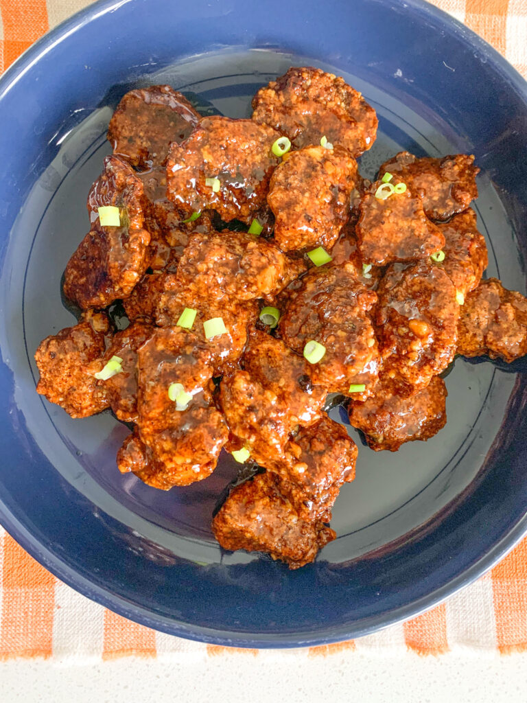 freshly cooked and coated baked orange chicken