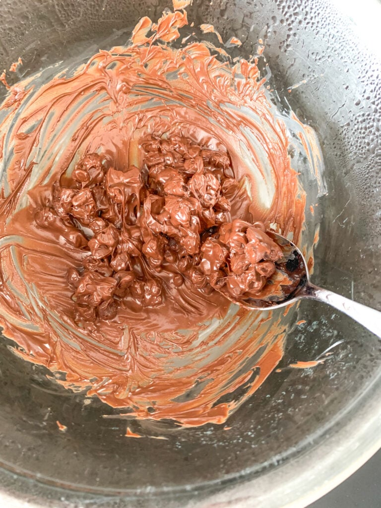 melting chocolate over double broiler