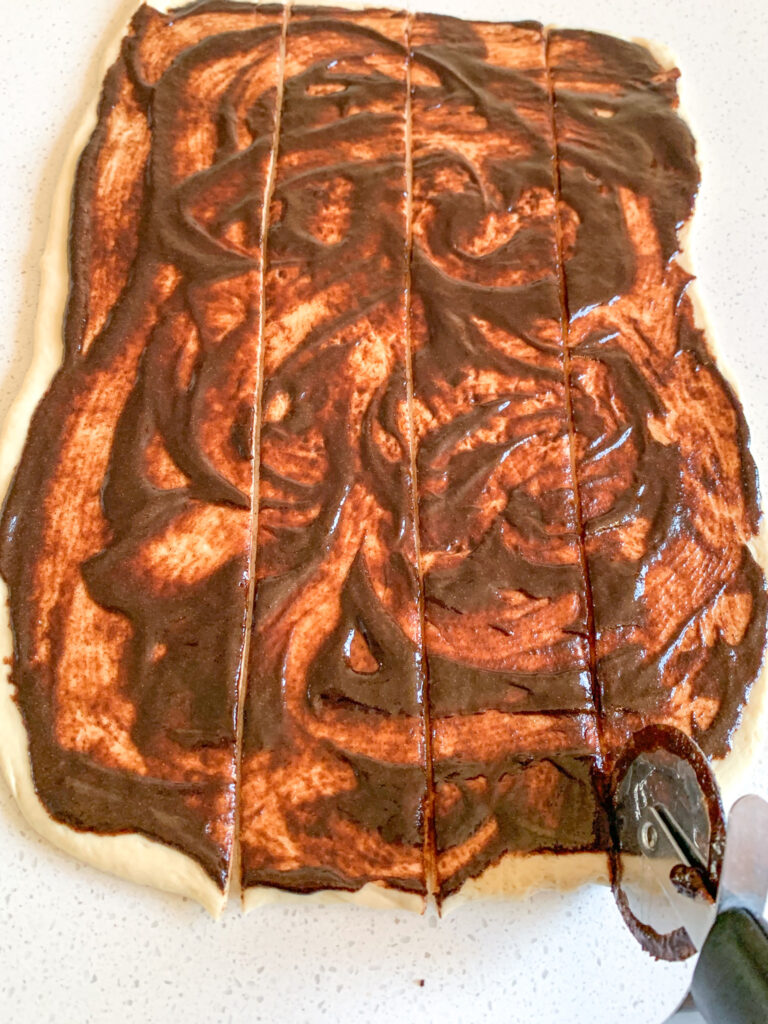 slicing king cake dough