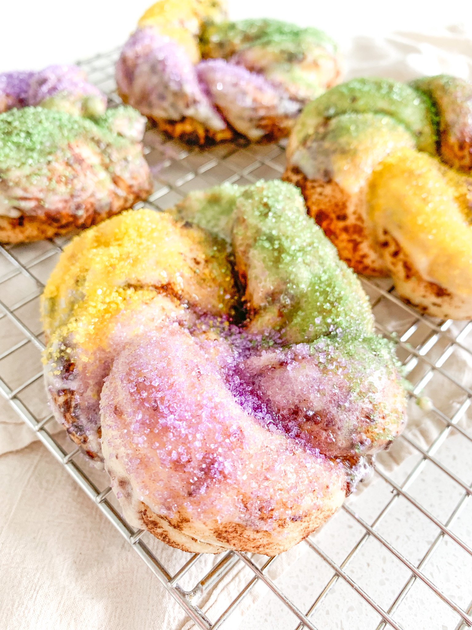 baked and decorated mini sourdough king cakes