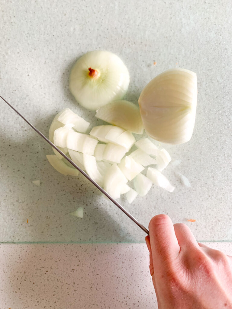 chopping onion for stock