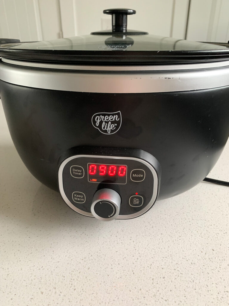 chicken stock cooking in slow cooker