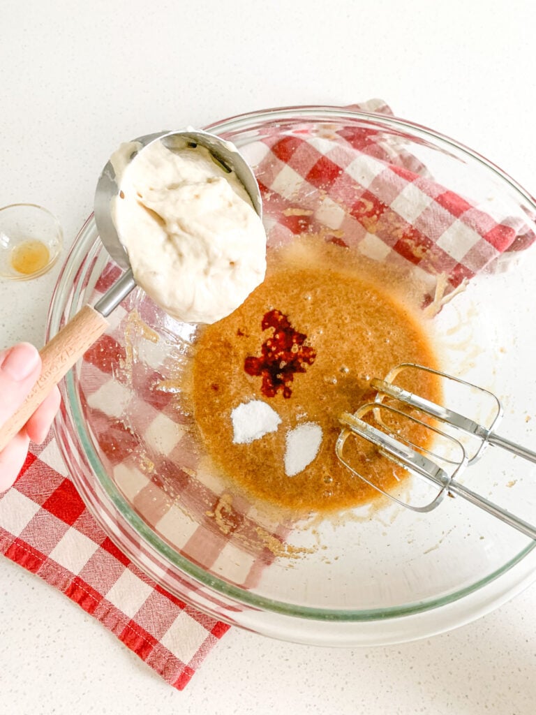 adding brown butter sourdough cookie wet ingredients
