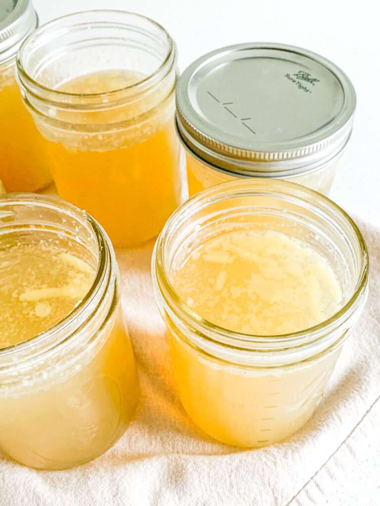 freshly cooked slow cooker chicken stock with rotisserie chicken