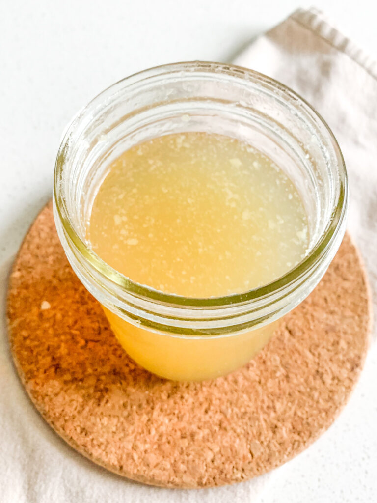 freshly cooked slow cooker chicken stock with rotisserie chicken