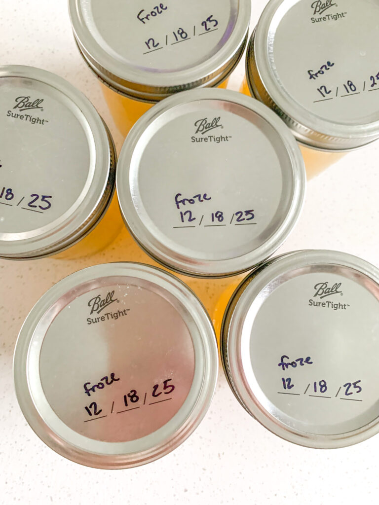 freshly cooked slow cooker chicken stock with rotisserie chicken